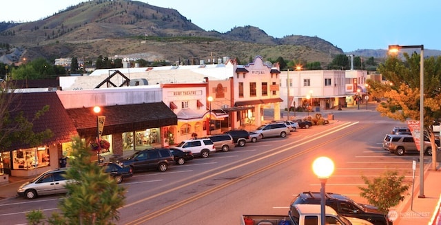 view of road with sidewalks and a mountain view