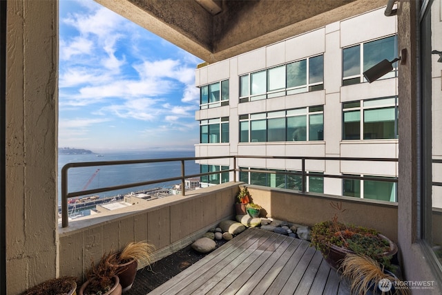 balcony featuring a water view