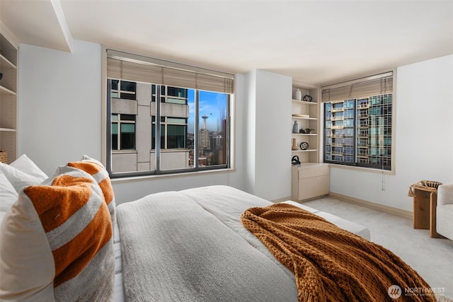 carpeted bedroom with baseboards