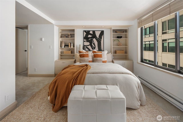 bedroom featuring a baseboard radiator, carpet flooring, and baseboards