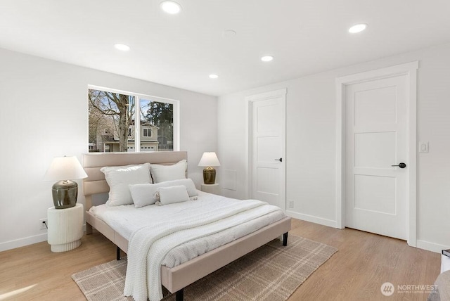 bedroom featuring recessed lighting, baseboards, and light wood finished floors