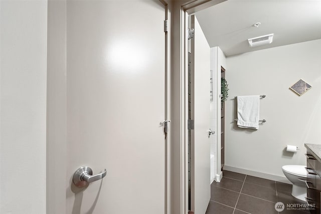 full bath featuring a shower, visible vents, toilet, vanity, and tile patterned flooring