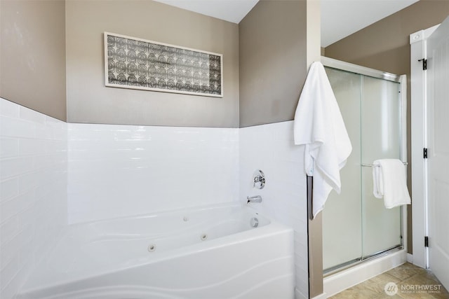 bathroom featuring a jetted tub and a stall shower