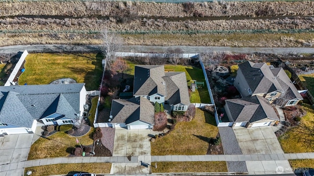 birds eye view of property with a residential view