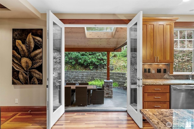 doorway with french doors and light wood-style floors