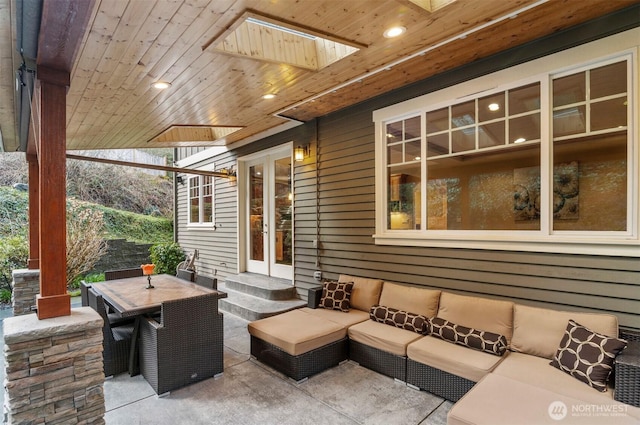 view of patio featuring an outdoor hangout area, french doors, and outdoor dining space