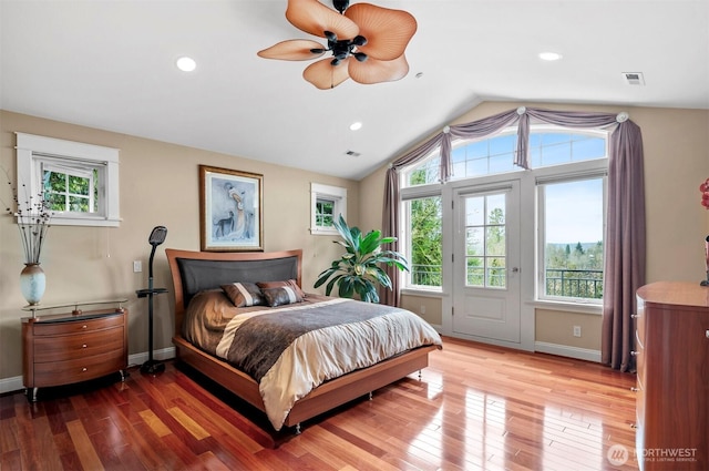 bedroom with light wood-type flooring, recessed lighting, baseboards, and lofted ceiling