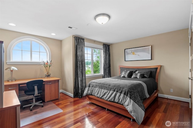 bedroom featuring recessed lighting, wood-type flooring, visible vents, and baseboards