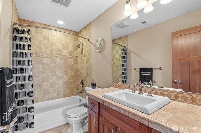 full bathroom with toilet, visible vents, shower / bath combo with shower curtain, and vanity