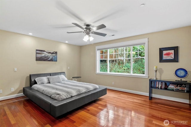 bedroom with recessed lighting, baseboards, visible vents, and hardwood / wood-style floors