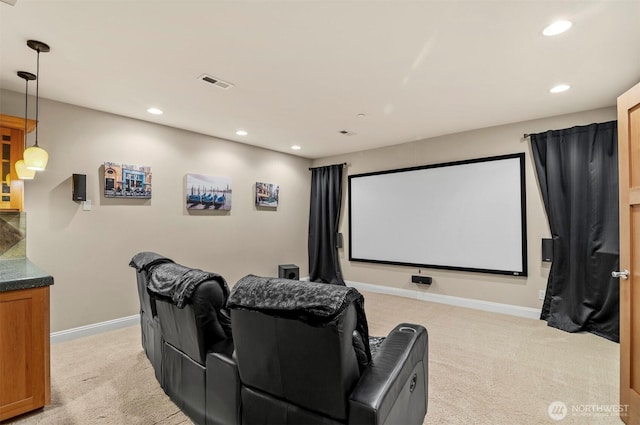 home theater with recessed lighting, light colored carpet, visible vents, and baseboards