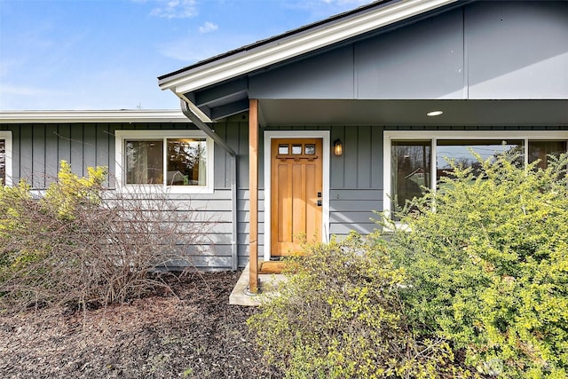 doorway to property with board and batten siding