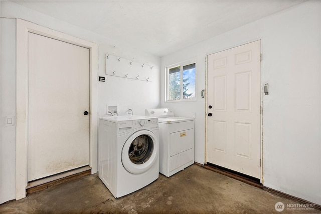 washroom with laundry area and washer and dryer