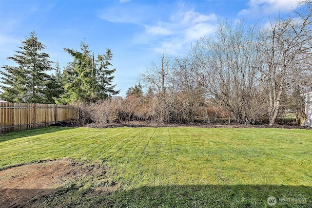 view of yard featuring fence