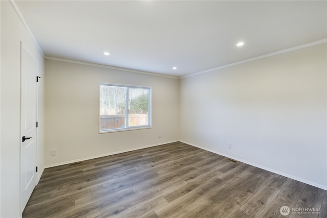 unfurnished room with baseboards, ornamental molding, dark wood finished floors, and recessed lighting