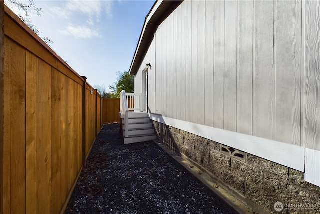 view of home's exterior featuring fence