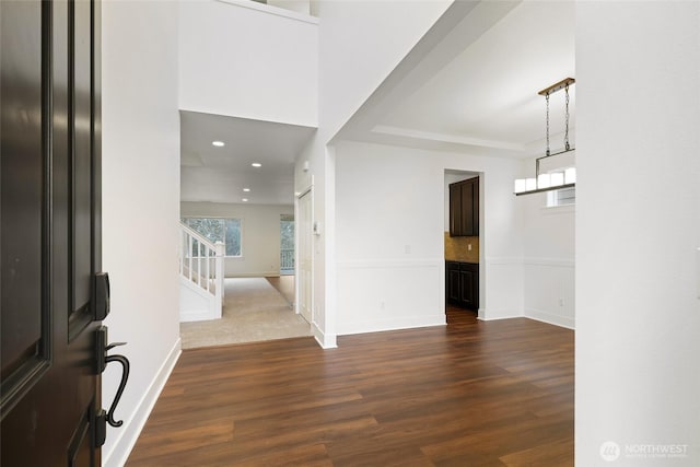 entrance foyer featuring stairs, dark wood-style flooring, recessed lighting, and baseboards