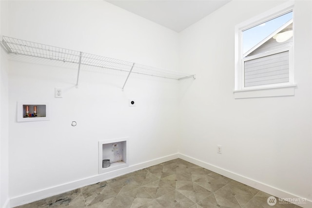 clothes washing area with hookup for a washing machine, hookup for a gas dryer, hookup for an electric dryer, laundry area, and baseboards