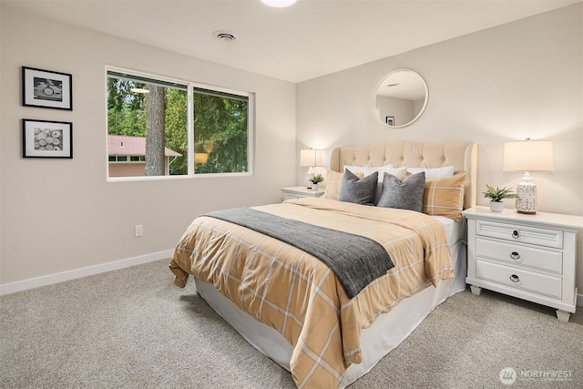 bedroom featuring light colored carpet, visible vents, and baseboards