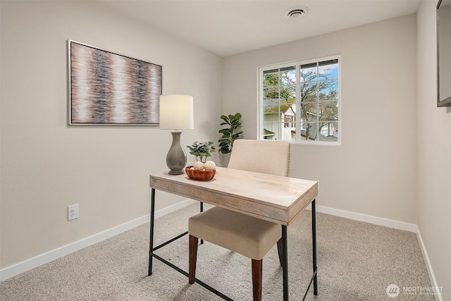 carpeted home office with visible vents and baseboards