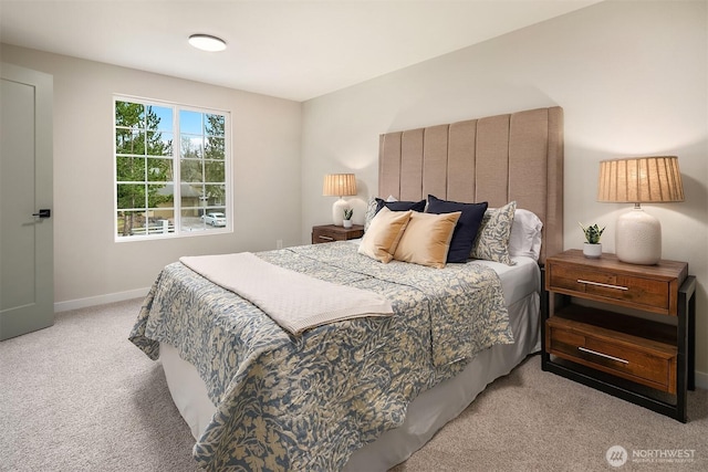 carpeted bedroom with baseboards