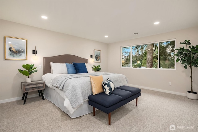 bedroom with recessed lighting, light colored carpet, and baseboards