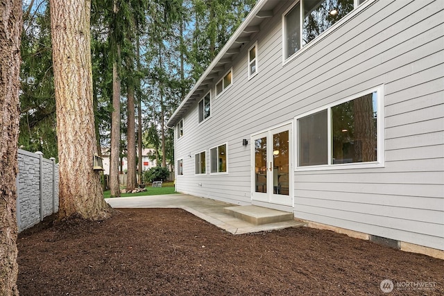 back of house featuring french doors, a patio area, and fence