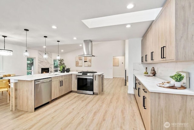 kitchen with range hood, stainless steel appliances, backsplash, light brown cabinetry, and a sink