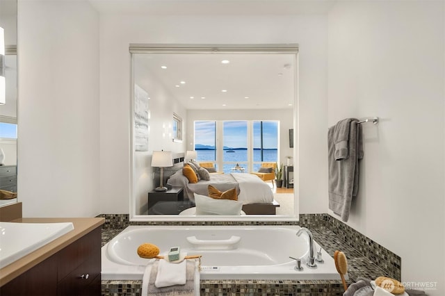 1514 Alki Ave SW, Seattle, WA 98116 - bathroom with connected bathroom, a water view, a bath, vanity, and recessed lighting