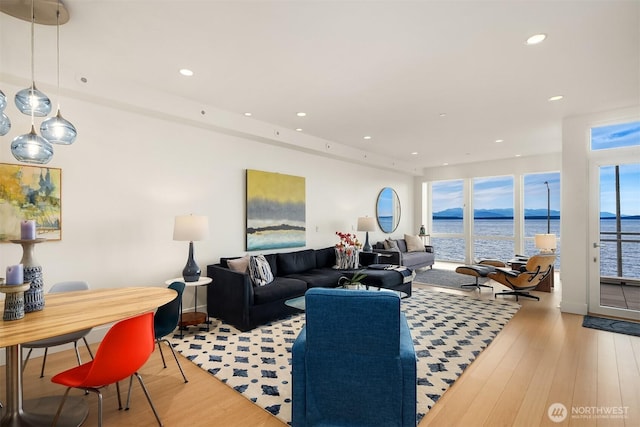 1514 Alki Ave SW, Seattle, WA 98116 - living area with a water view, light wood-type flooring, and recessed lighting