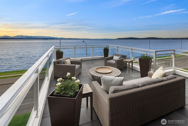 1514 Alki Ave SW, Seattle, WA 98116 - view of patio / terrace featuring an outdoor hangout area and a water view