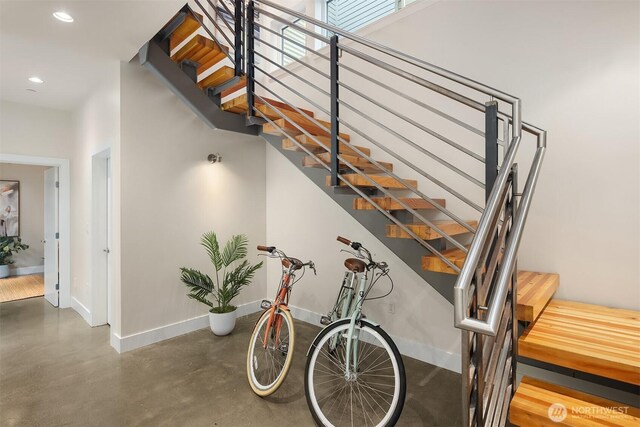 1514 Alki Ave SW, Seattle, WA 98116 - stairs featuring baseboards, finished concrete floors, and recessed lighting