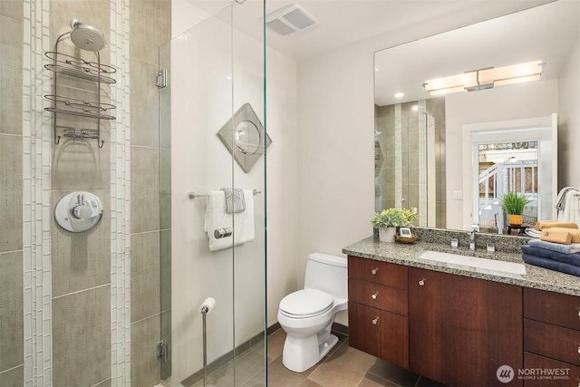 1514 Alki Ave SW, Seattle, WA 98116 - bathroom with a stall shower, tile patterned flooring, toilet, and vanity
