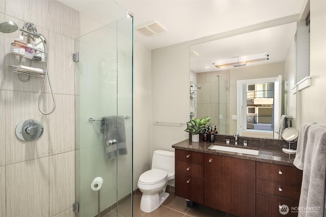 1514 Alki Ave SW, Seattle, WA 98116 - full bath with a shower stall, tile patterned floors, vanity, and toilet