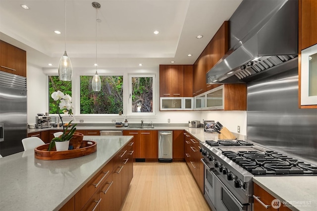 1514 Alki Ave SW, Seattle, WA 98116 - kitchen with wall chimney exhaust hood, stainless steel appliances, plenty of natural light, modern cabinets, and recessed lighting
