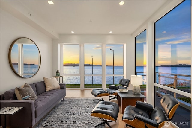 1514 Alki Ave SW, Seattle, WA 98116 - living area featuring a water view, wood finished floors, and recessed lighting