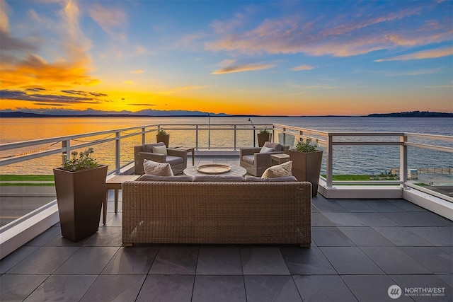 1514 Alki Ave SW, Seattle, WA 98116 - balcony at dusk featuring an outdoor hangout area and a water view