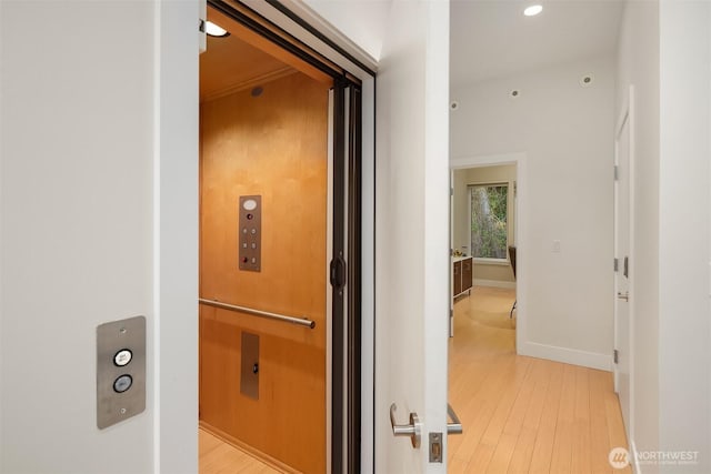 1514 Alki Ave SW, Seattle, WA 98116 - hall featuring light wood-type flooring, recessed lighting, baseboards, and elevator