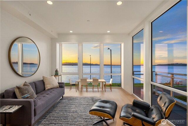 1514 Alki Ave SW, Seattle, WA 98116 - living room with a water view, healthy amount of natural light, recessed lighting, and wood finished floors