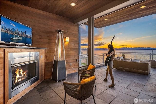 1514 Alki Ave SW, Seattle, WA 98116 - patio terrace at dusk with a tile fireplace