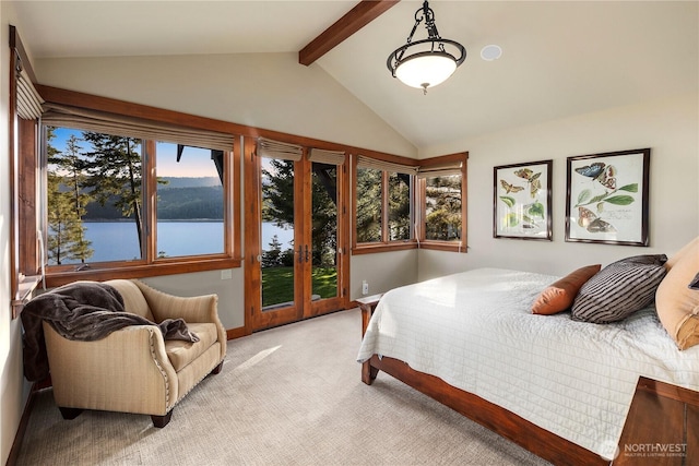 bedroom with light carpet, lofted ceiling with beams, and a water view