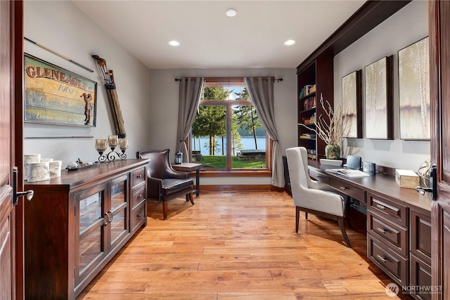 office space with light wood-style floors, recessed lighting, and baseboards