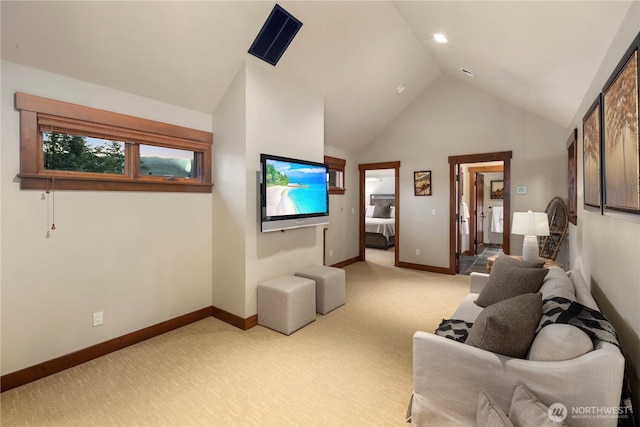 living area featuring light carpet, high vaulted ceiling, and baseboards