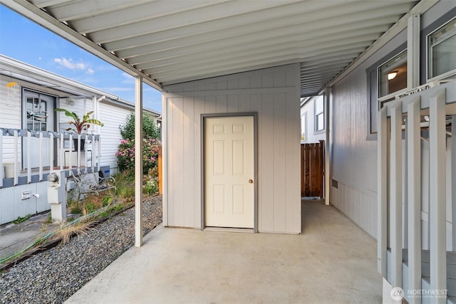 exterior space featuring an attached carport and a patio area