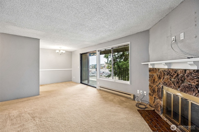 unfurnished living room with a stone fireplace, a notable chandelier, carpet floors, and a baseboard radiator