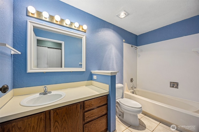 full bathroom featuring tile patterned floors, toilet, shower / bathing tub combination, vanity, and a textured wall