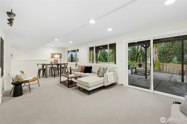 living room with carpet floors, baseboards, and recessed lighting