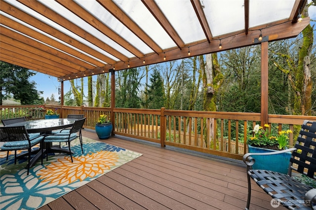 wooden deck with outdoor dining area