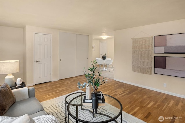 living room with wood finished floors and baseboards