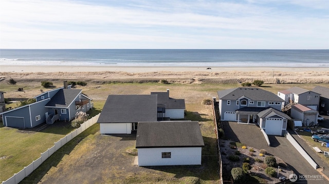 bird's eye view with a water view, a residential view, and a view of the beach